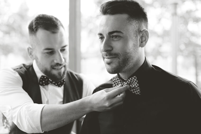 Best man fixing groom s bow tie 000063809937 Small jpg