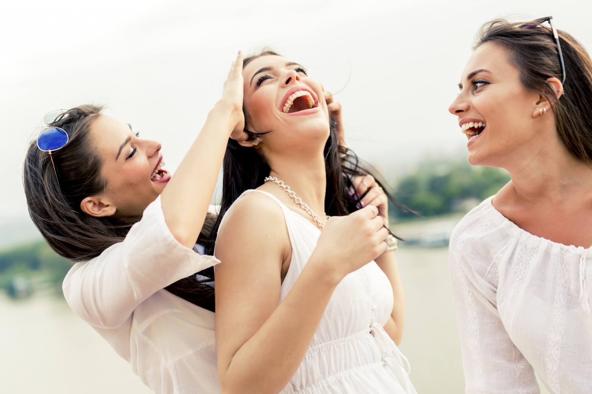 Cheerful women having fun outdoors 000072923775 Large jpg