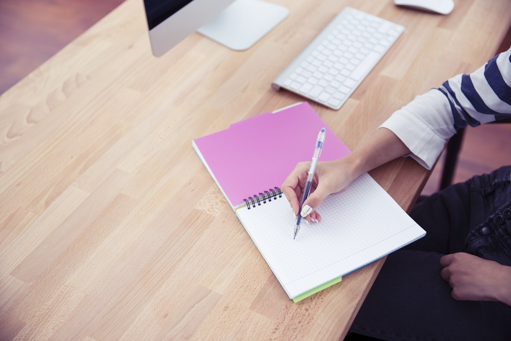 Girl writing notes in office 000070366281 Medium jpg