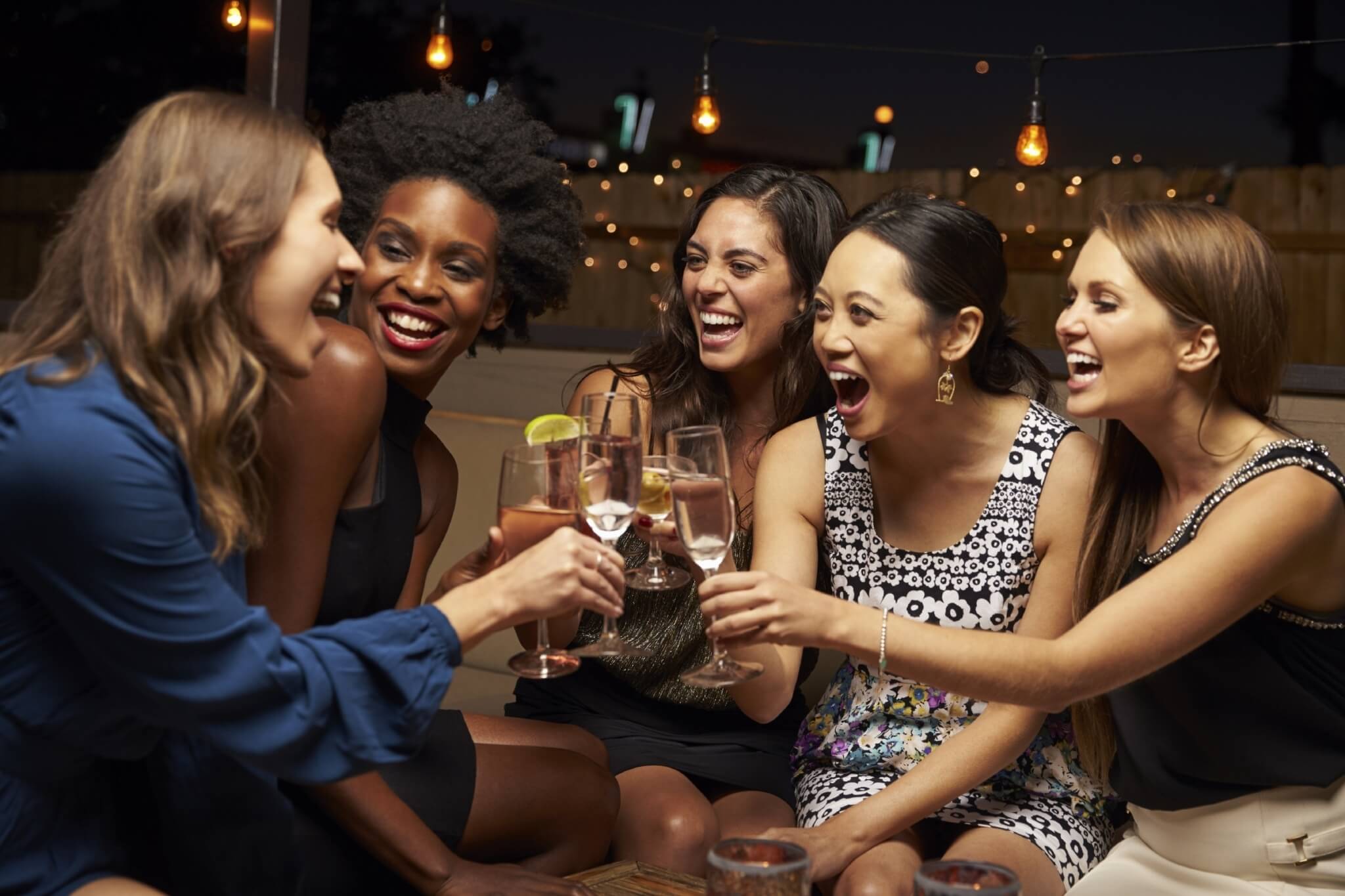 Group Of Female Friends Enjoying Night Out At Rooftop Bar 000083961111 Large jpg